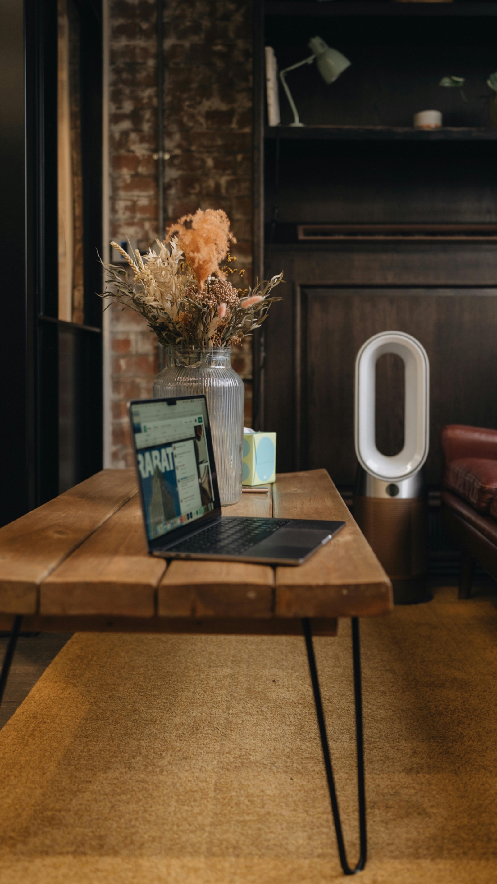 A quiet workspace with a single laptop — a thinking space, not a sales pitch.