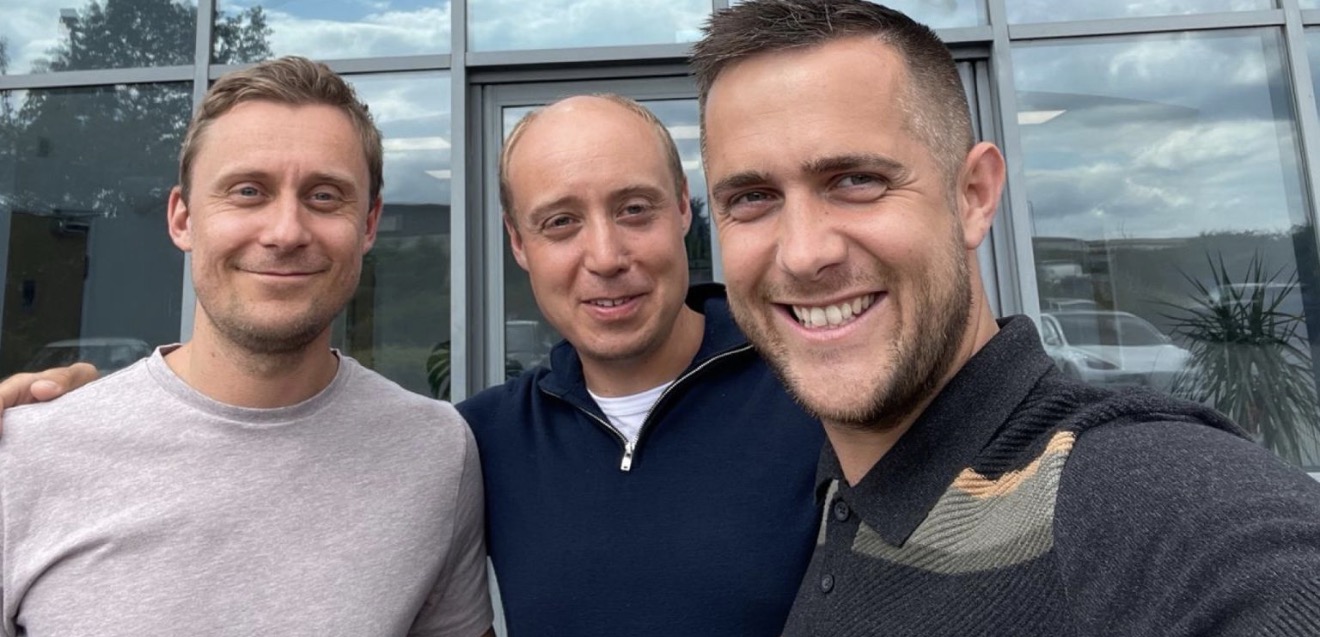 Trent Peek, William Walker and Charlie Walker standing together outside the offices at Membury.